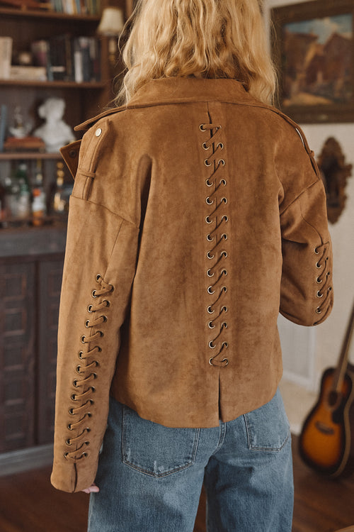 Back view of the cognac jacket showing the silhouette and fit.