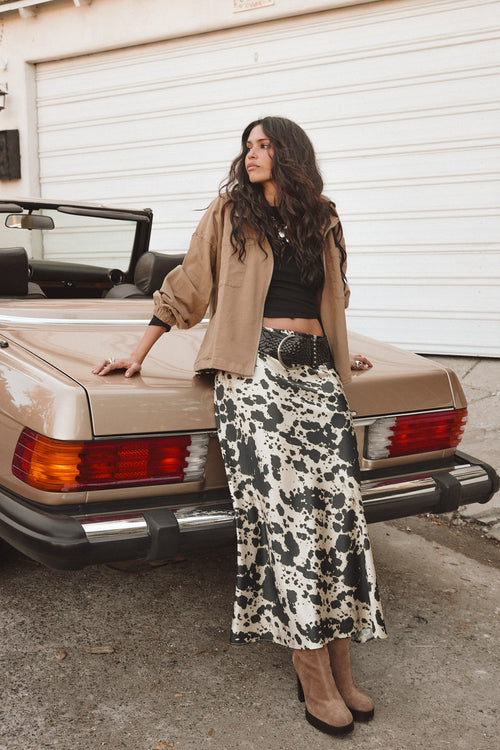 Maxi skirt with elegant accents, a cowhide skirt essential.