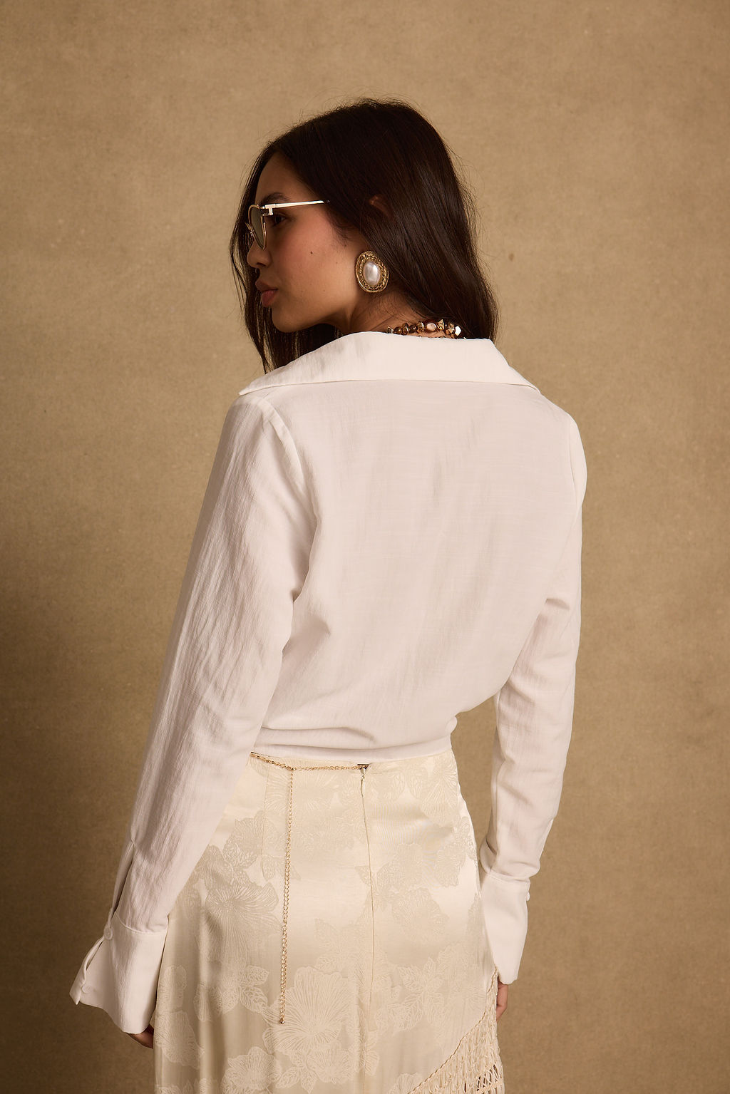 Close-up of the Adriana White Tie Front Top showcasing the fabric texture and design details.