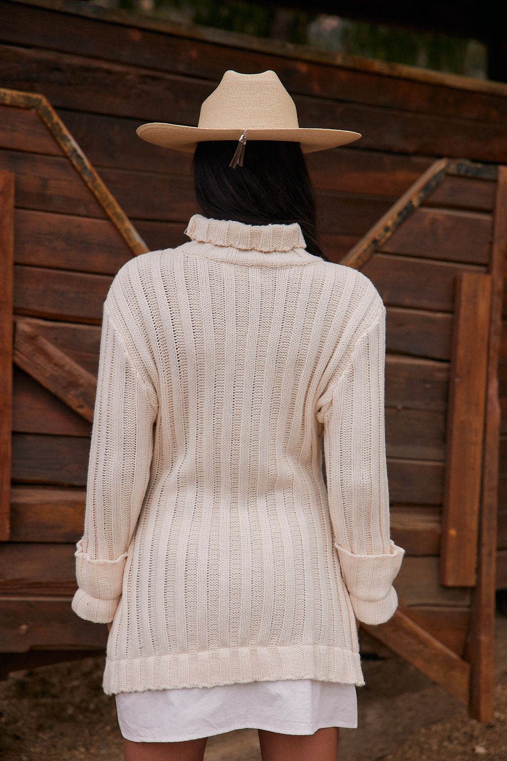Detail shot of the Allison White Long Sleeve Knit Mini Dress highlighting the knit elements.
