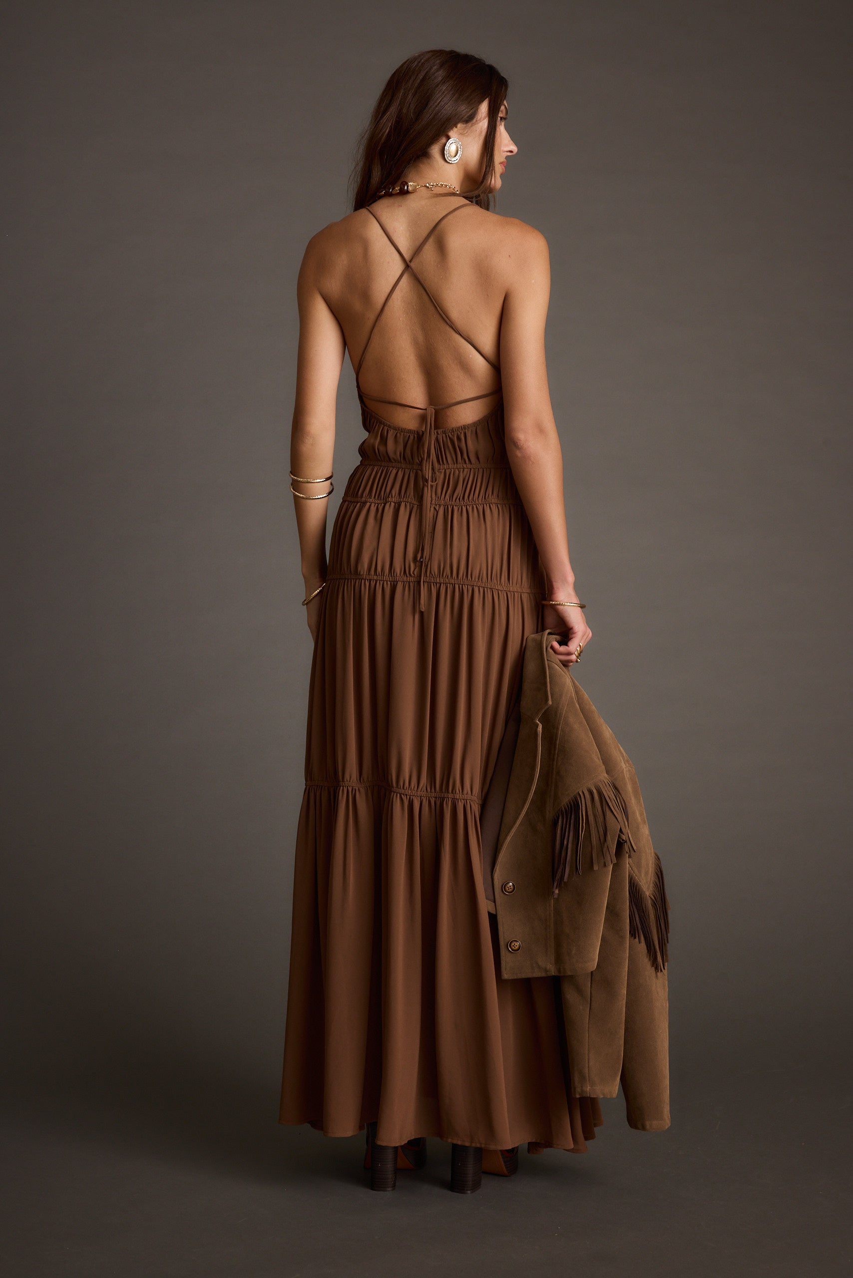 Lifestyle shot of the mocha maxi dress styled for day-to-night versatility.