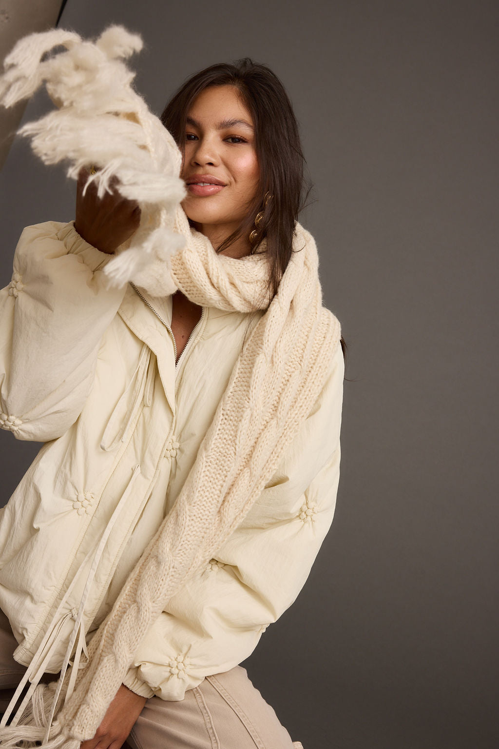 Alaska Cream Cable Knit Long Scarf styled in a complete look from an alternate angle.