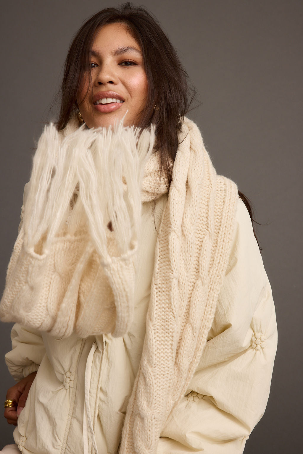 Close-up of the Alaska Cream Cable Knit Long Scarf showcasing the knit texture and craftsmanship.