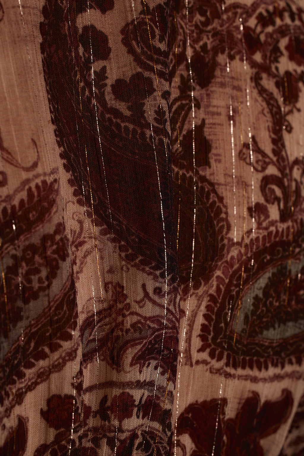 Lurex blouse fabric detail showing silver and gold metallic thread through paisley print