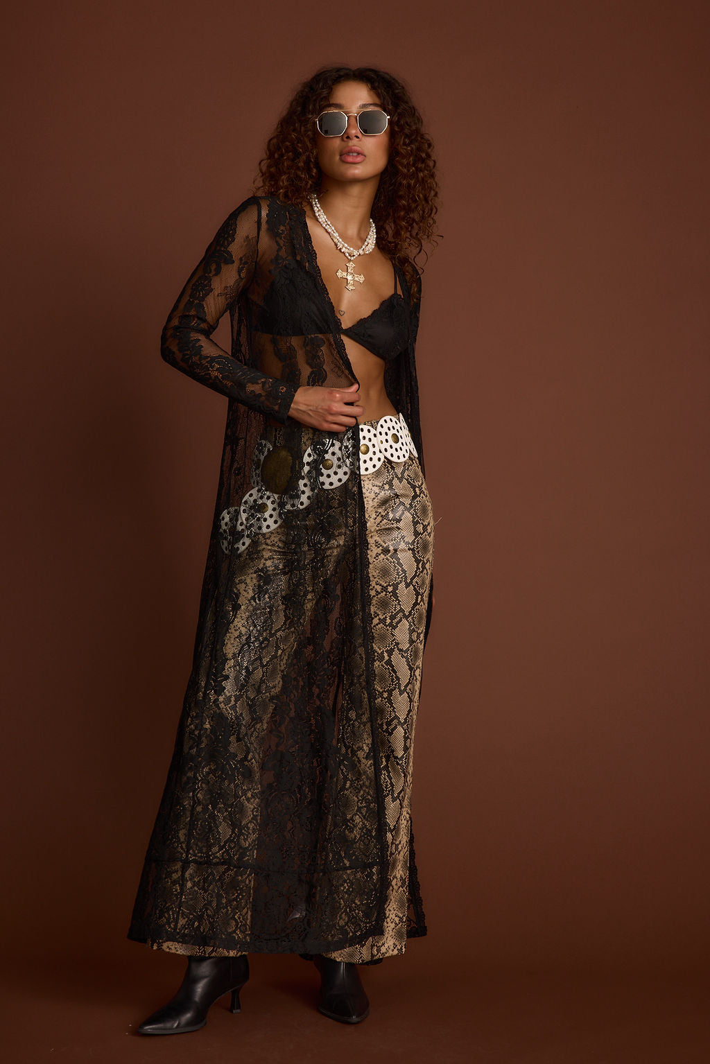 Lifestyle shot of the black piece styled for day-to-night versatility.