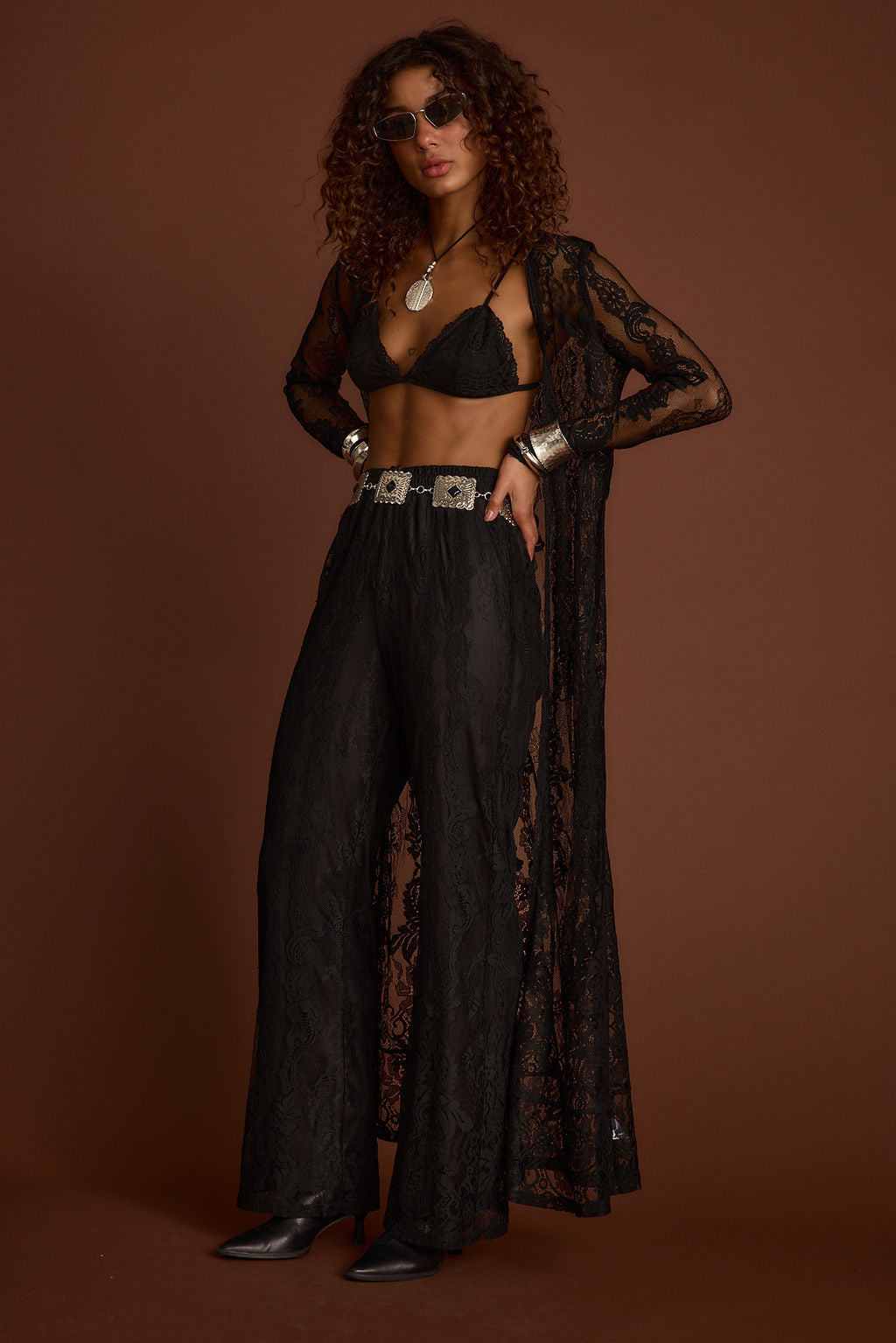 Black lace piece with refined accents, a black lace skirt essential.