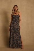 Front view of a black and brown floral maxi dress with spaghetti straps and a side slit
