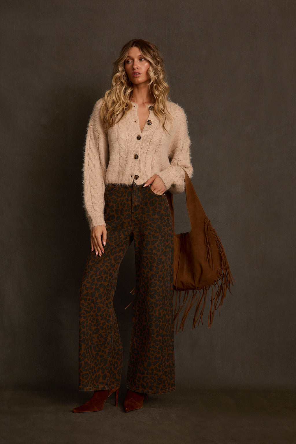 Fall cardigan back view showing cable knit pattern and relaxed cropped length