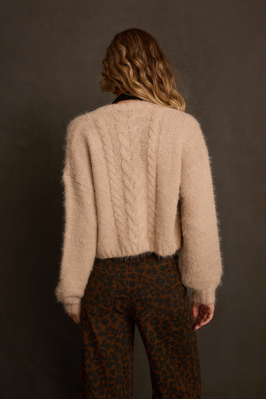 Cropped cardigan side angle showing balloon sleeve and fuzzy mohair-blend texture