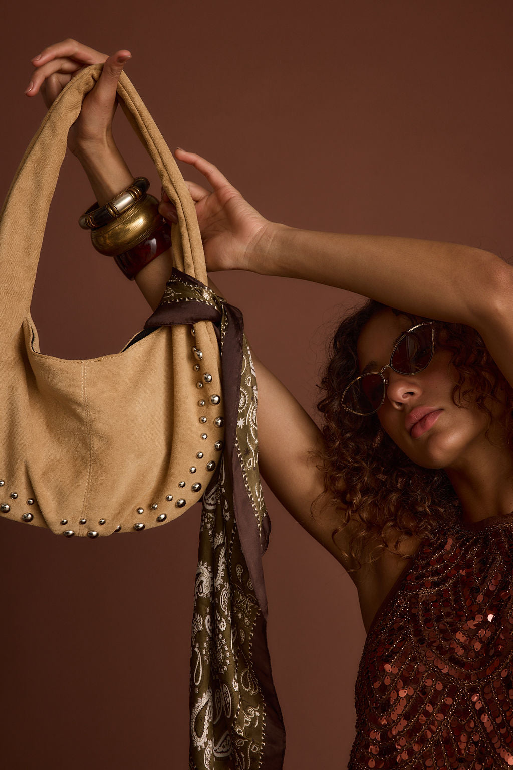 Bandit Olive Paisley Scarf paired with complementary accessories for a polished look.