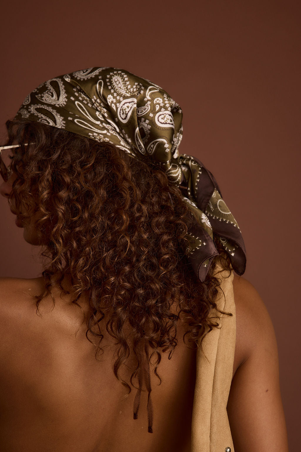 Detail shot of the Bandit Olive Paisley Scarf highlighting the design elements.