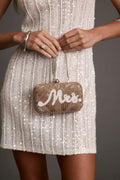 Beaded bag with refined detailing and a flattering silhouette.