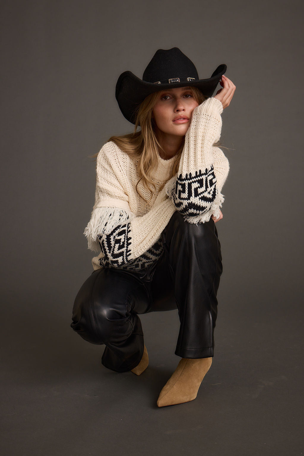 Detail shot of the Bozeman Cream Printed Fringe Sweater highlighting the fringe elements.