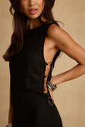 Black linen top with refined accents, a black fringe top essential.