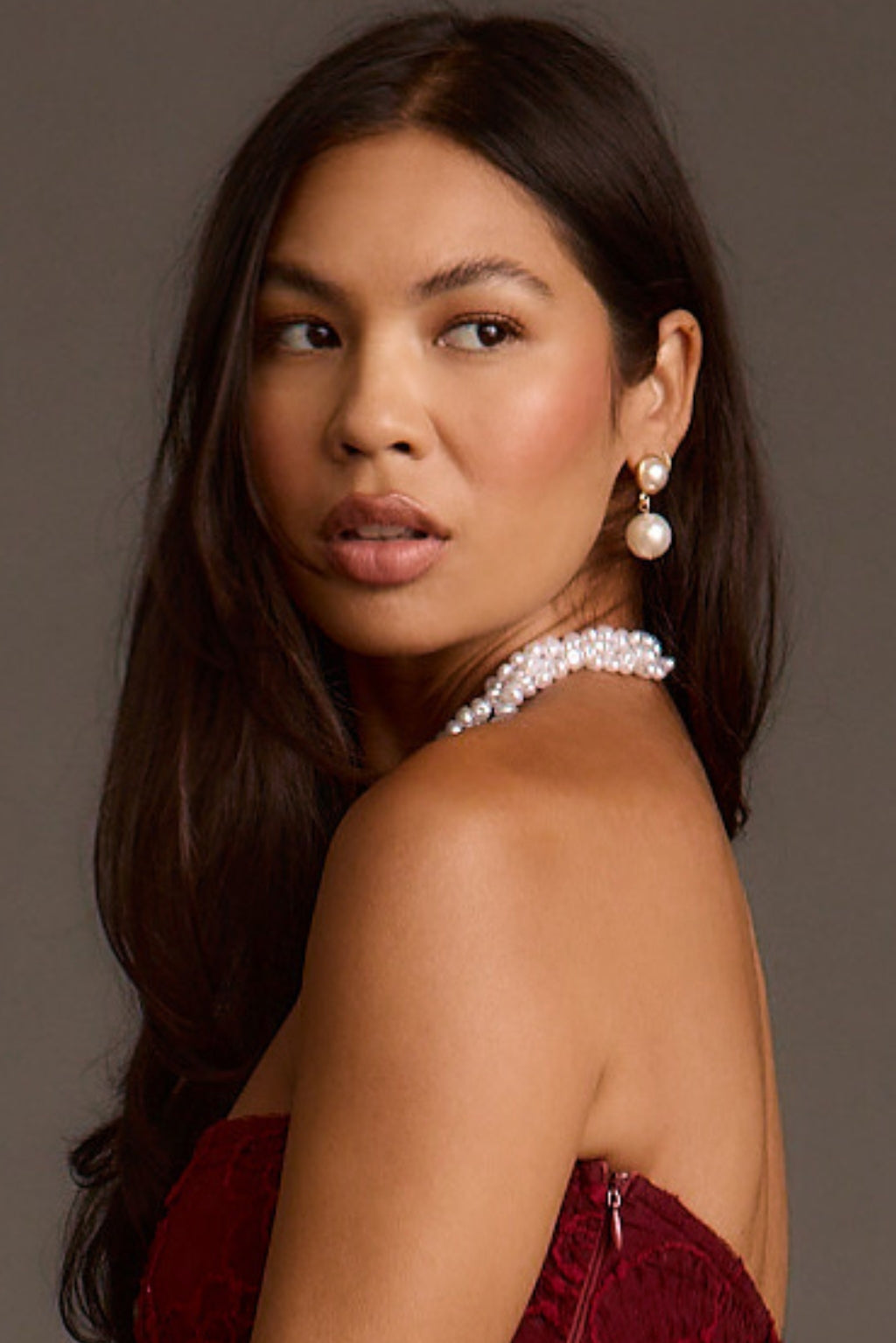 Double pearl drop earring shown in profile with a beaded pearl choker necklace.