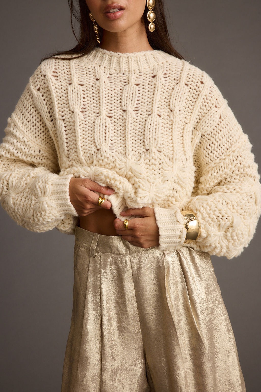 Close-up of the Bethany Cream Cable Knit Sweater showcasing the knit texture and craftsmanship.