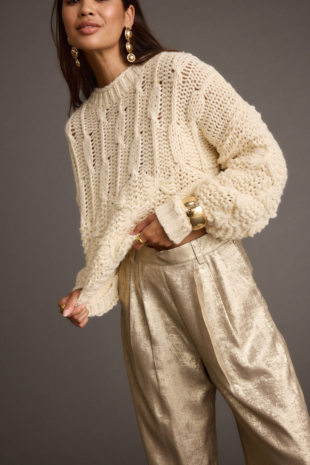Cream knit sweater with knit accents, a cable knit sweater dress essential.
