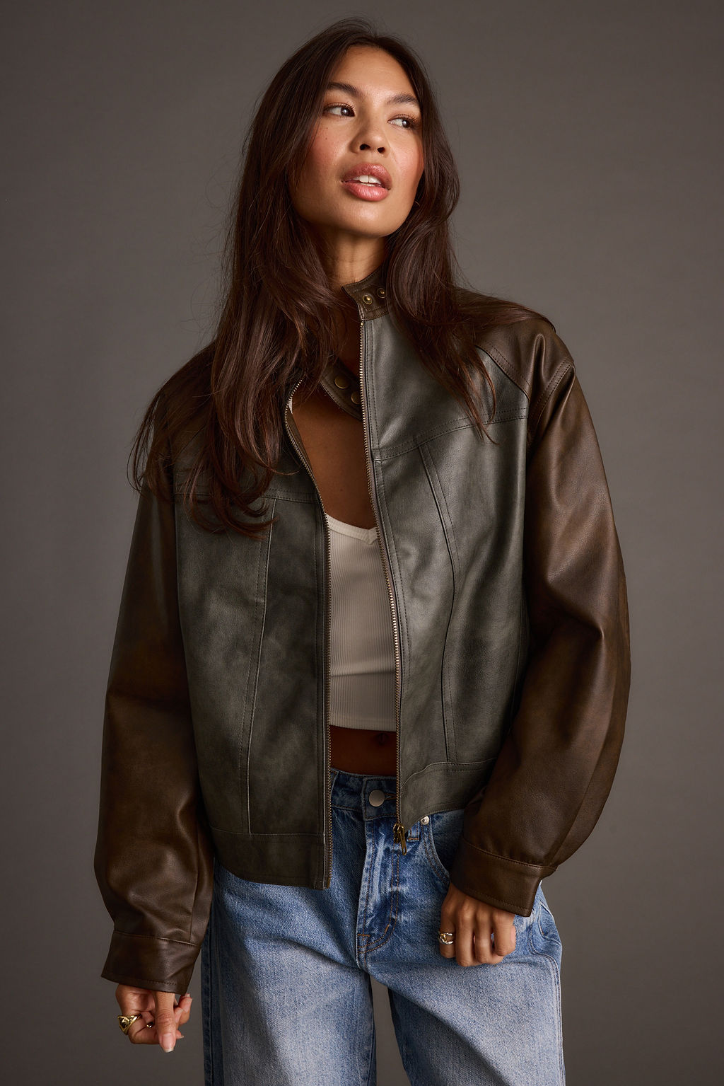Lifestyle shot of the moto jacket styled for day-to-night versatility.