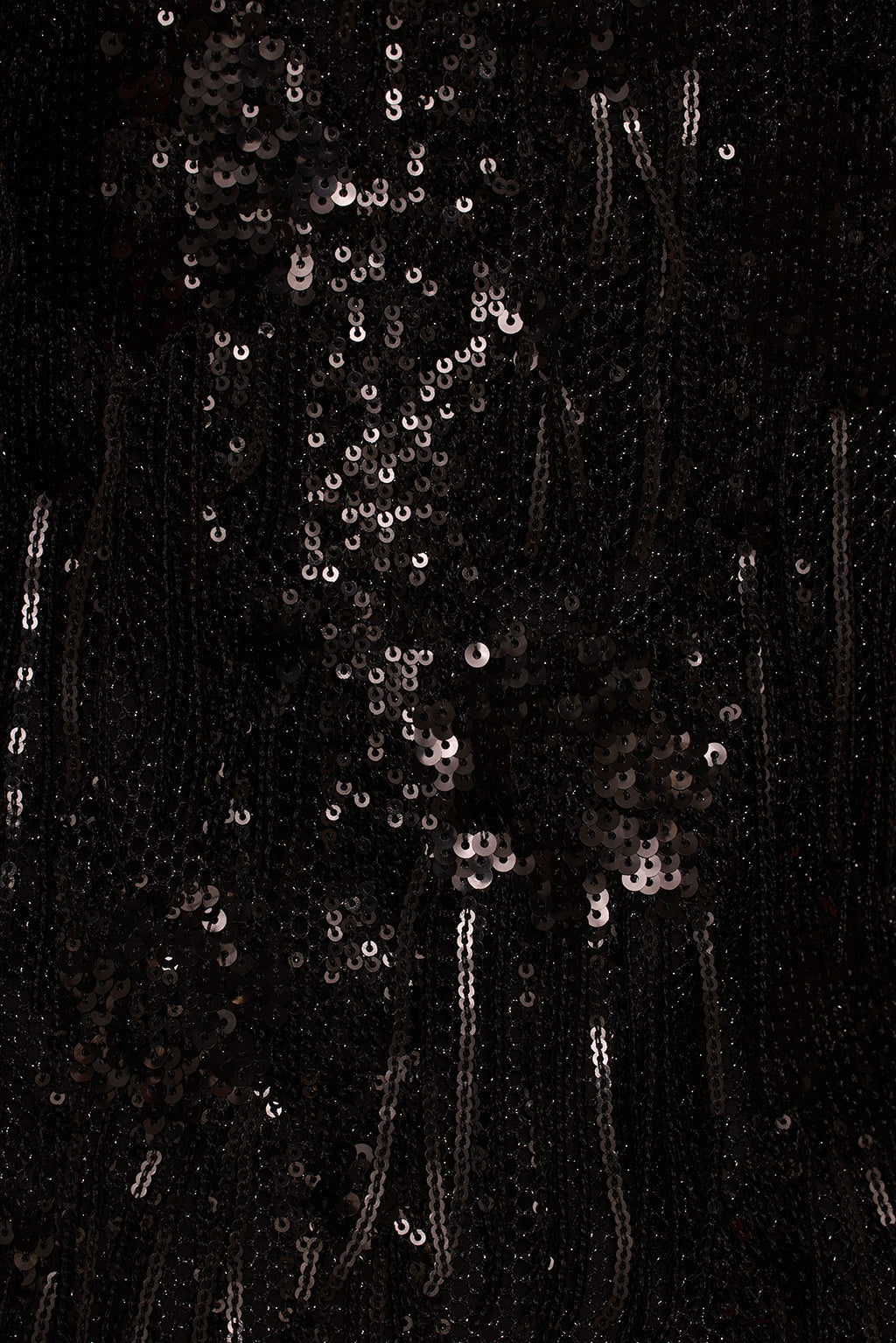 Mini dress close-up of gold beaded V neckline trim and black sequin body