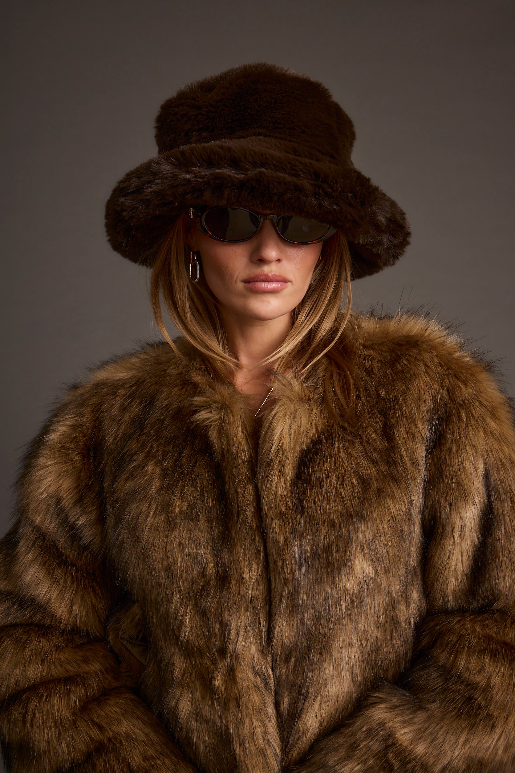 Bucket Down Espresso Faux Fur Hat paired with complementary accessories for a polished look.