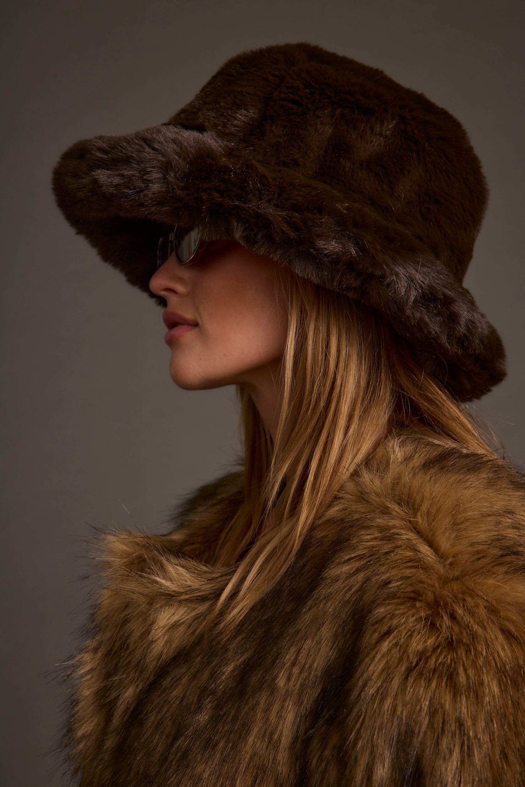Detail shot of the Bucket Down Espresso Faux Fur Hat highlighting the faux fur elements.