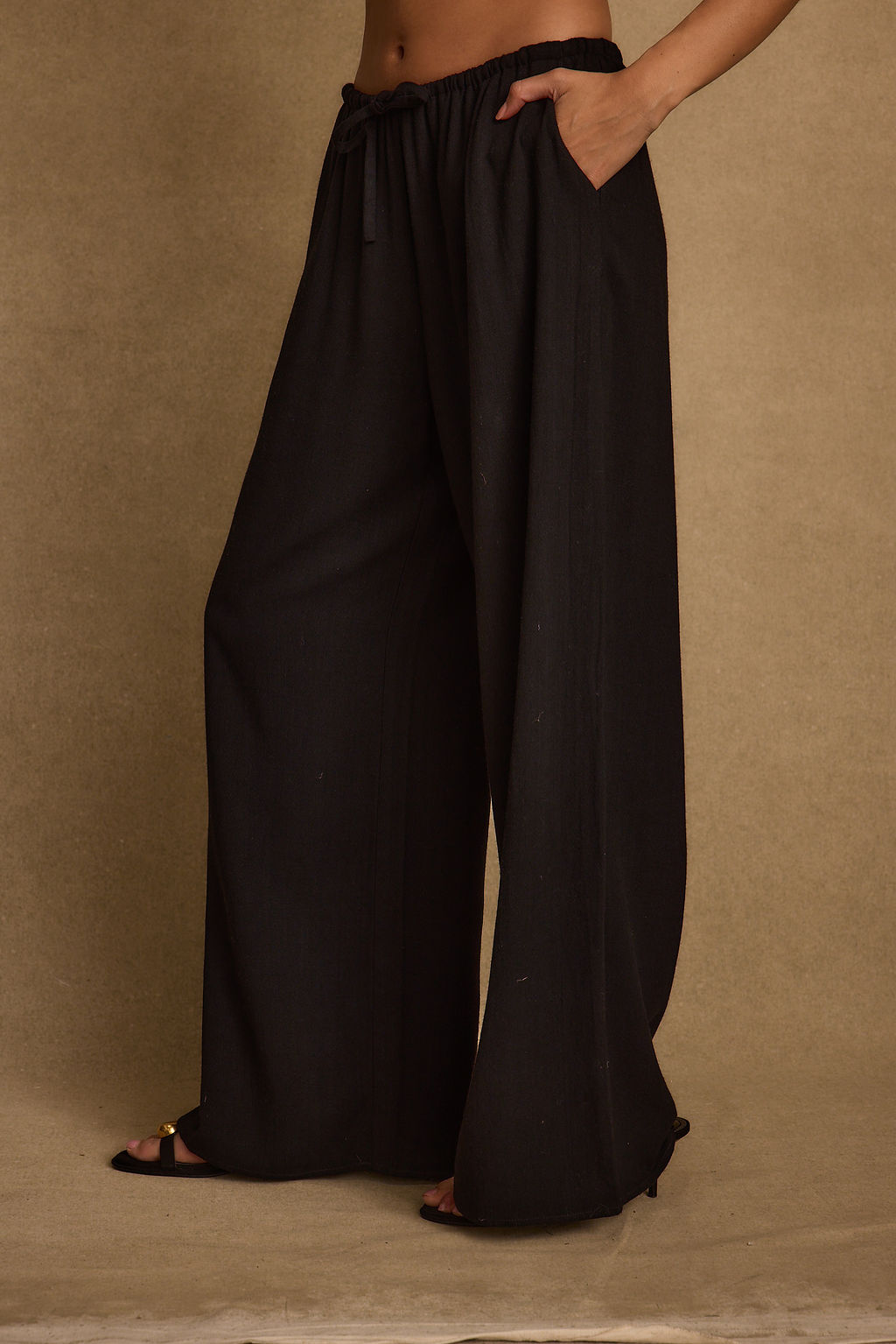 Detail shot of the Clear Breeze Black Linen Pants highlighting the linen elements.