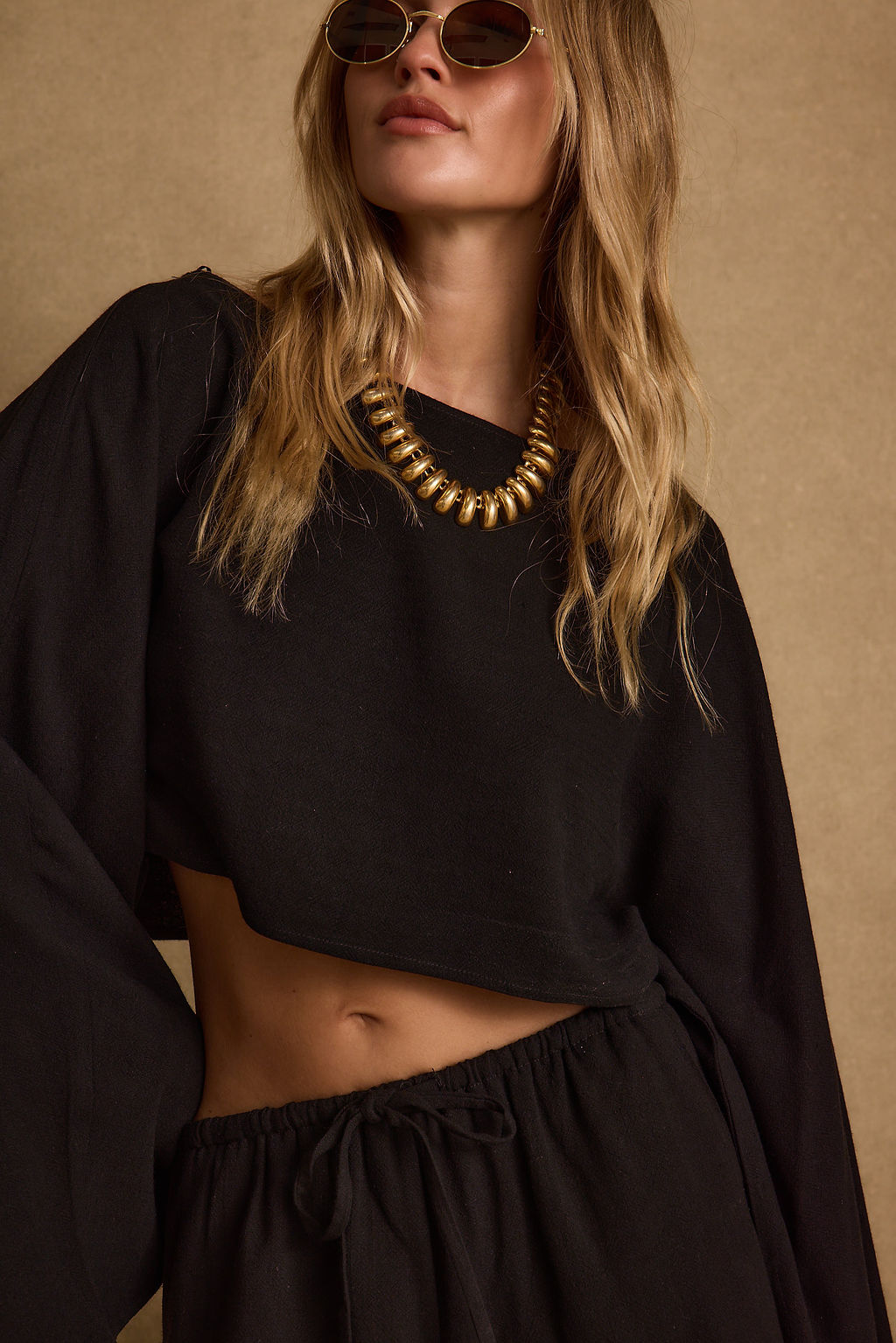 Detail shot of the Clear Breeze Black Linen Top highlighting the linen elements.