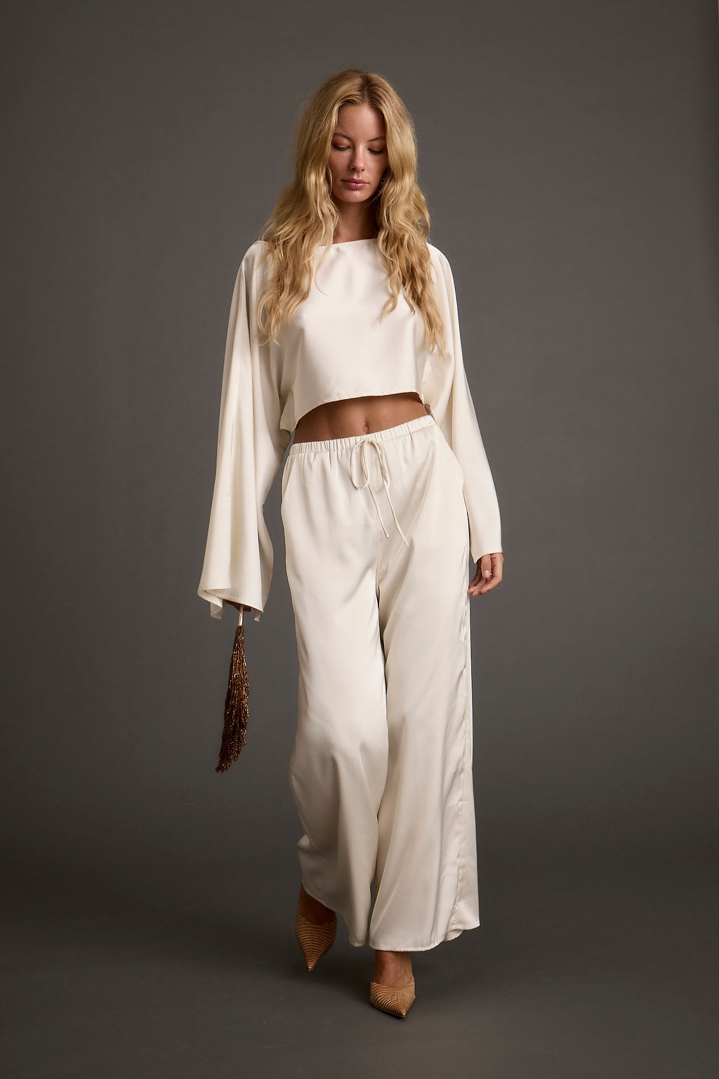 Clear Breeze Cream Satin Pants paired with complementary accessories for a polished look.
