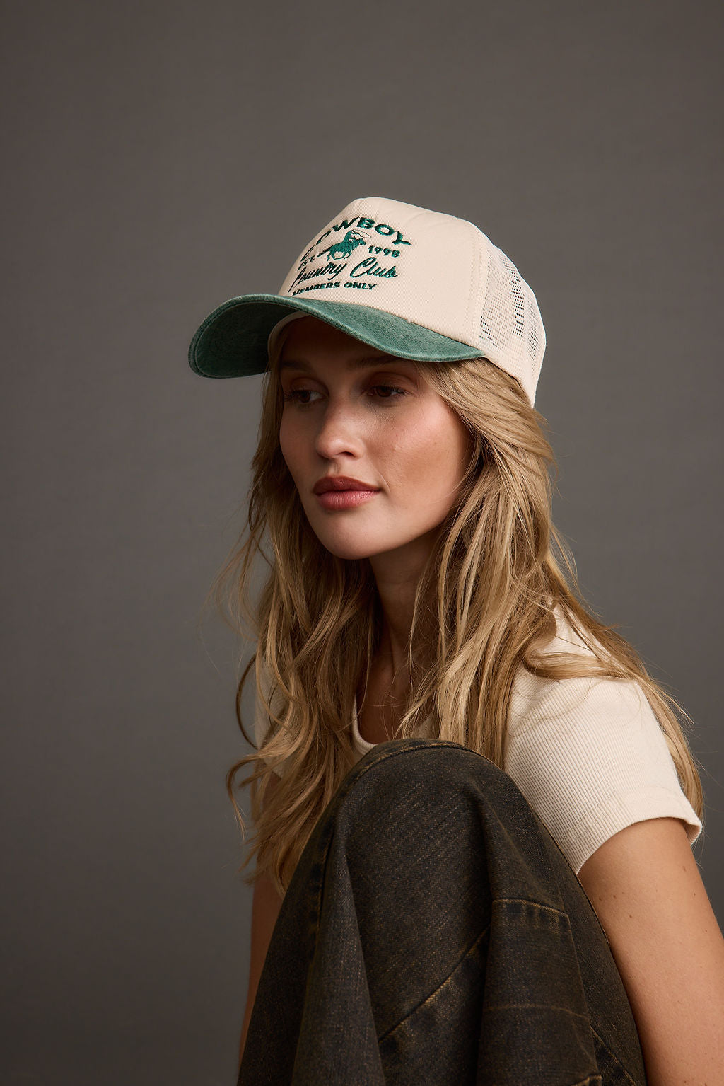 Cowboy Country Club Trucker Hat paired with complementary accessories for a polished look.