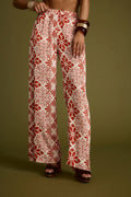 Rust satin pants with refined accents, a white satin pants standout.