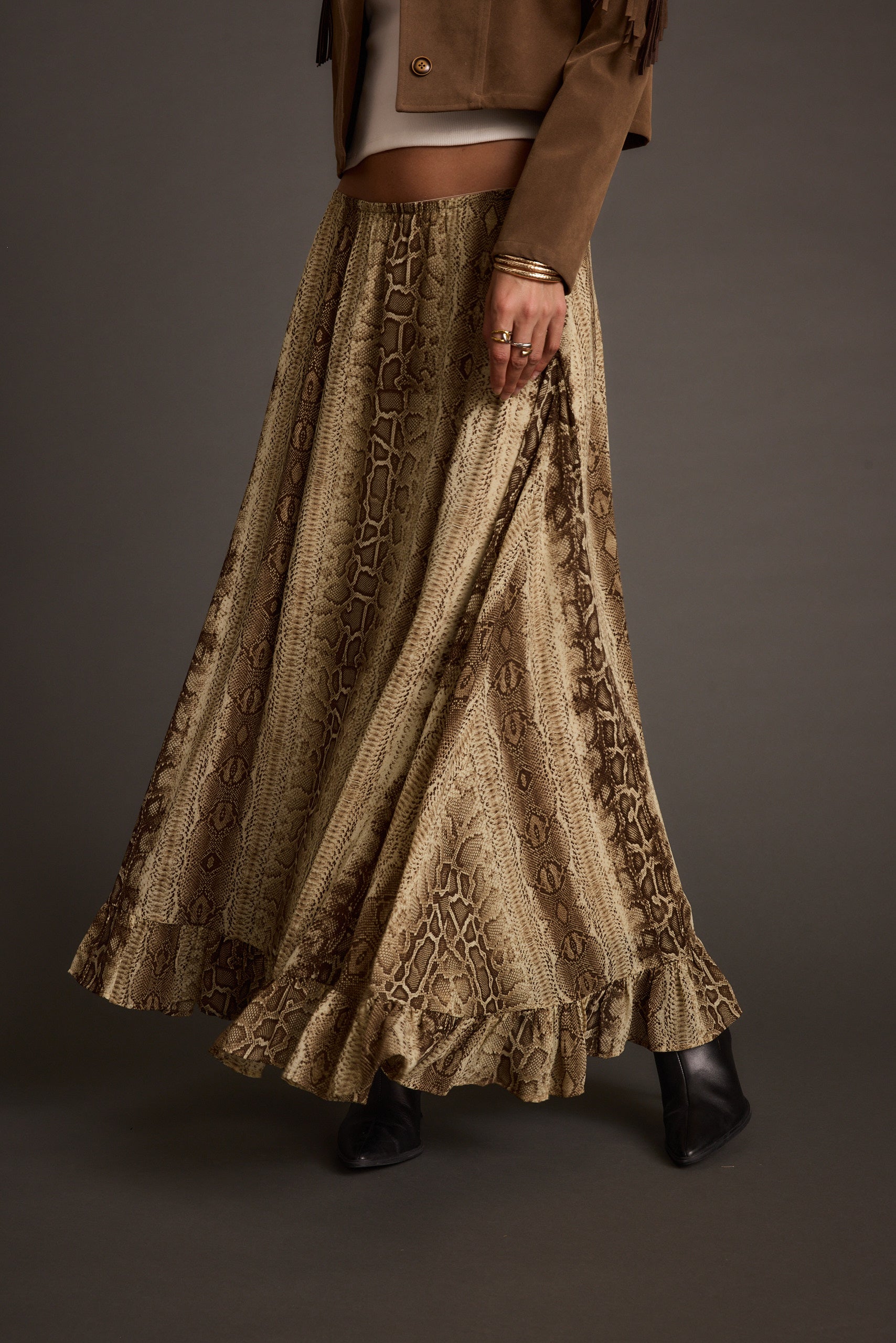Detail shot of the Calla Snake Print Maxi Skirt highlighting the design elements.