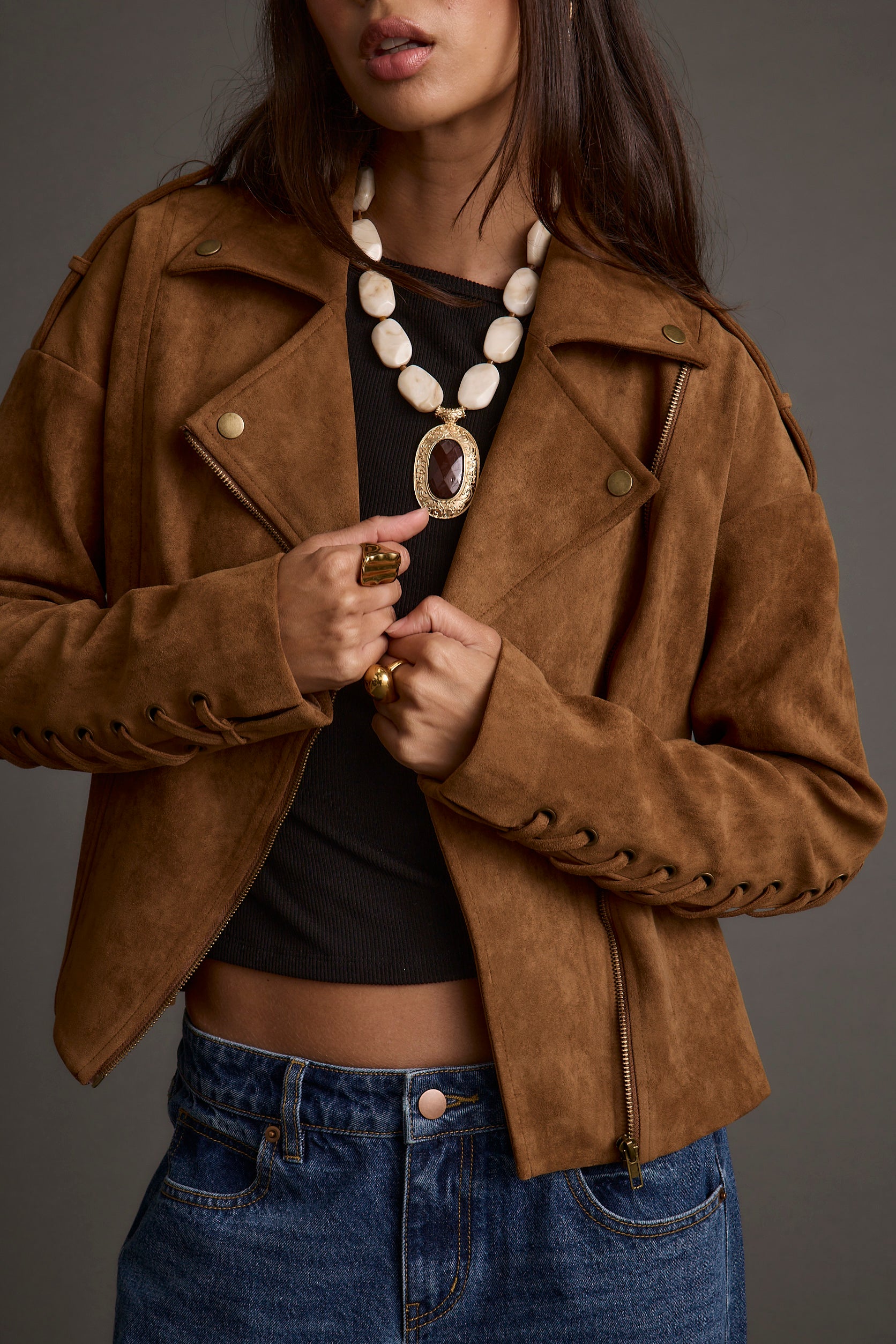 Lifestyle shot of the cognac jacket styled for day-to-night versatility.