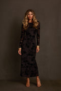 Velvet maxi dress in black burnout floral with long sleeves and fitted silhouette, gold cuffs