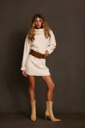 Sweater dress in cream with oversized turtleneck, belted with cognac studded belt and tan boots
