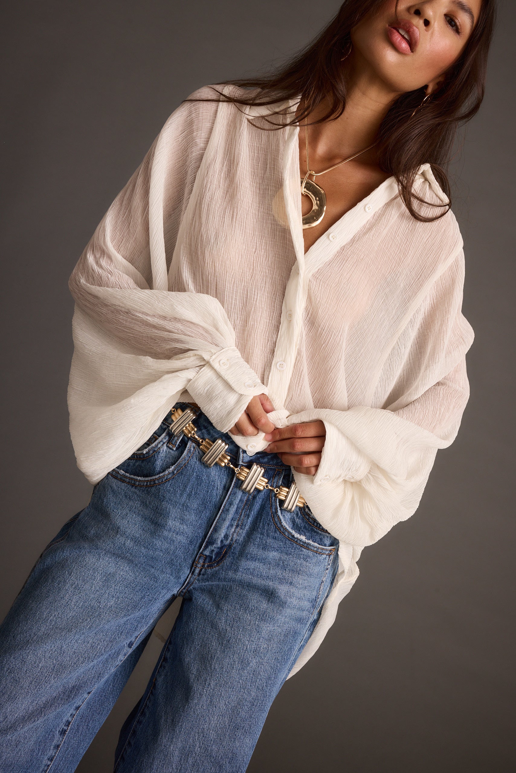 Back view of the ivory blouse showing the silhouette and fit.
