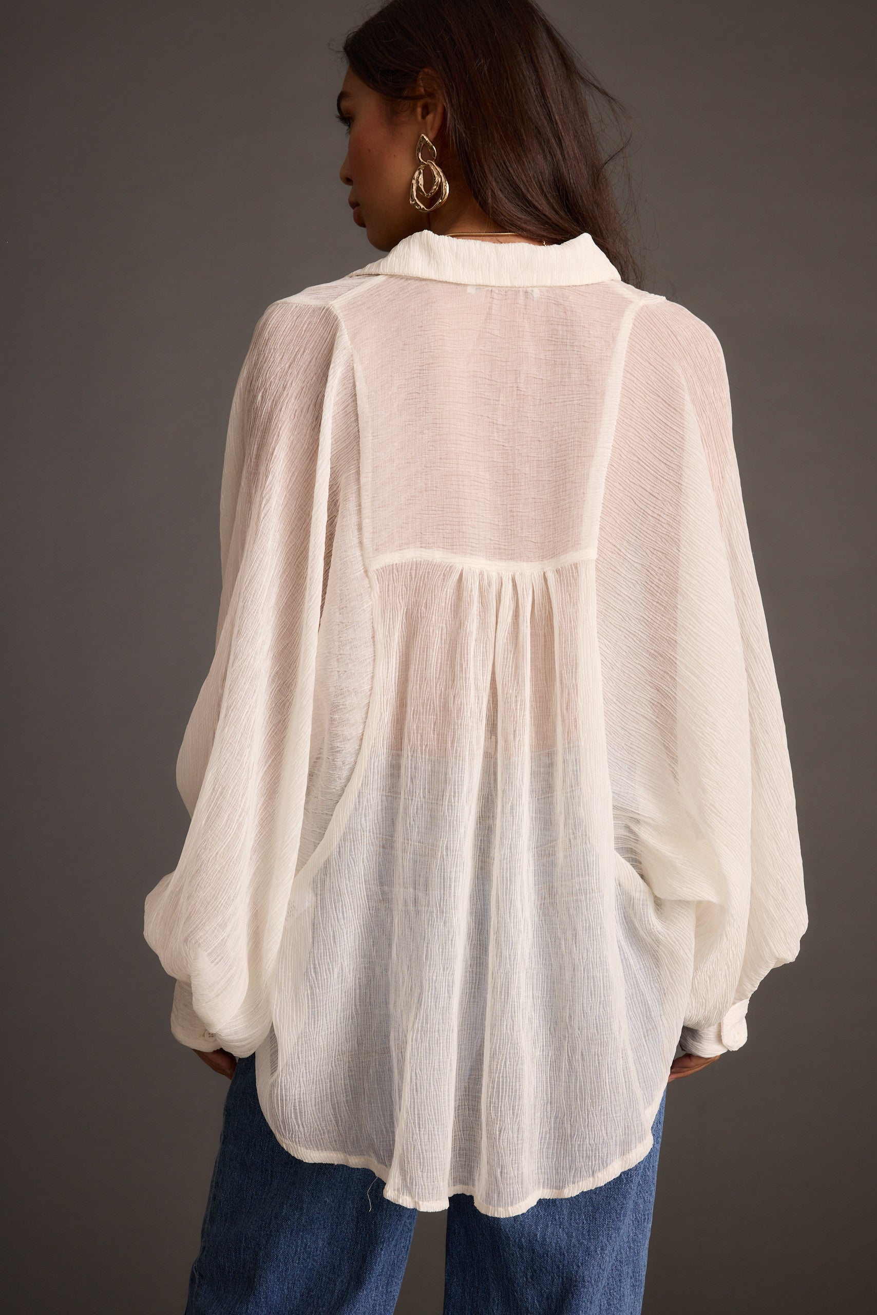 Claudia Ivory Oversized Blouse shown in a complementary styling arrangement.