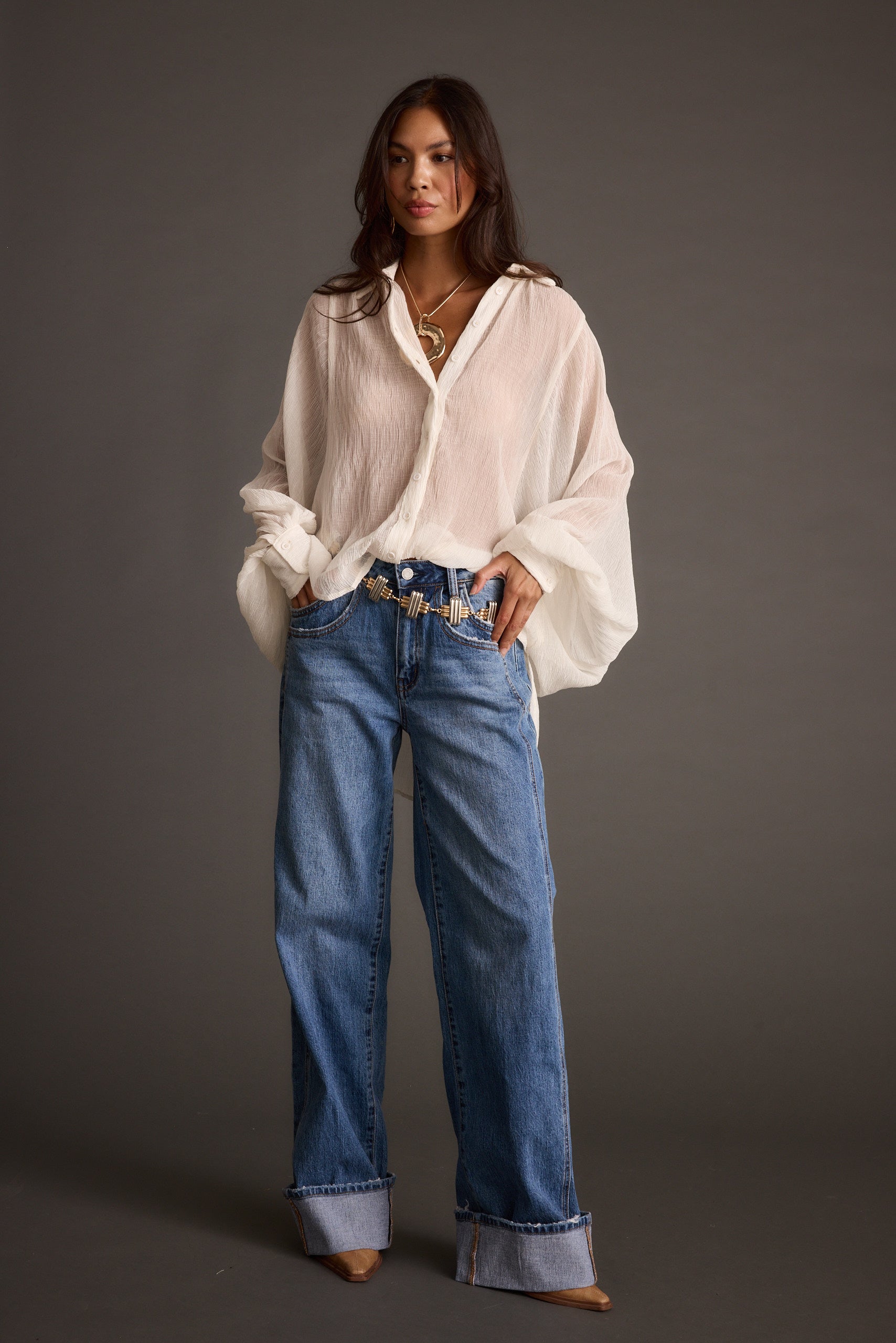 Claudia Ivory Oversized Blouse paired with complementary accessories for a polished look.