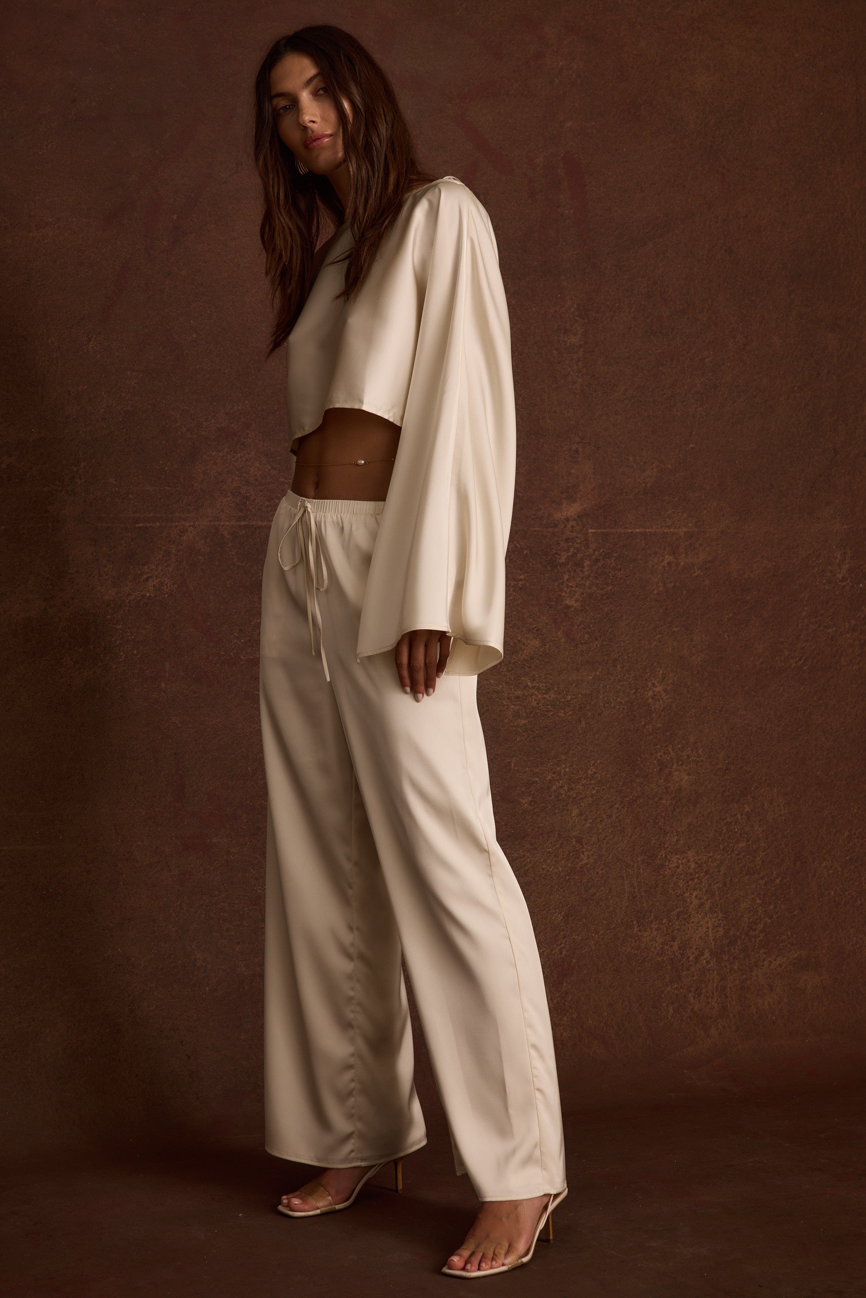 Additional view of the Clear Breeze Cream Satin Pants from a different perspective.