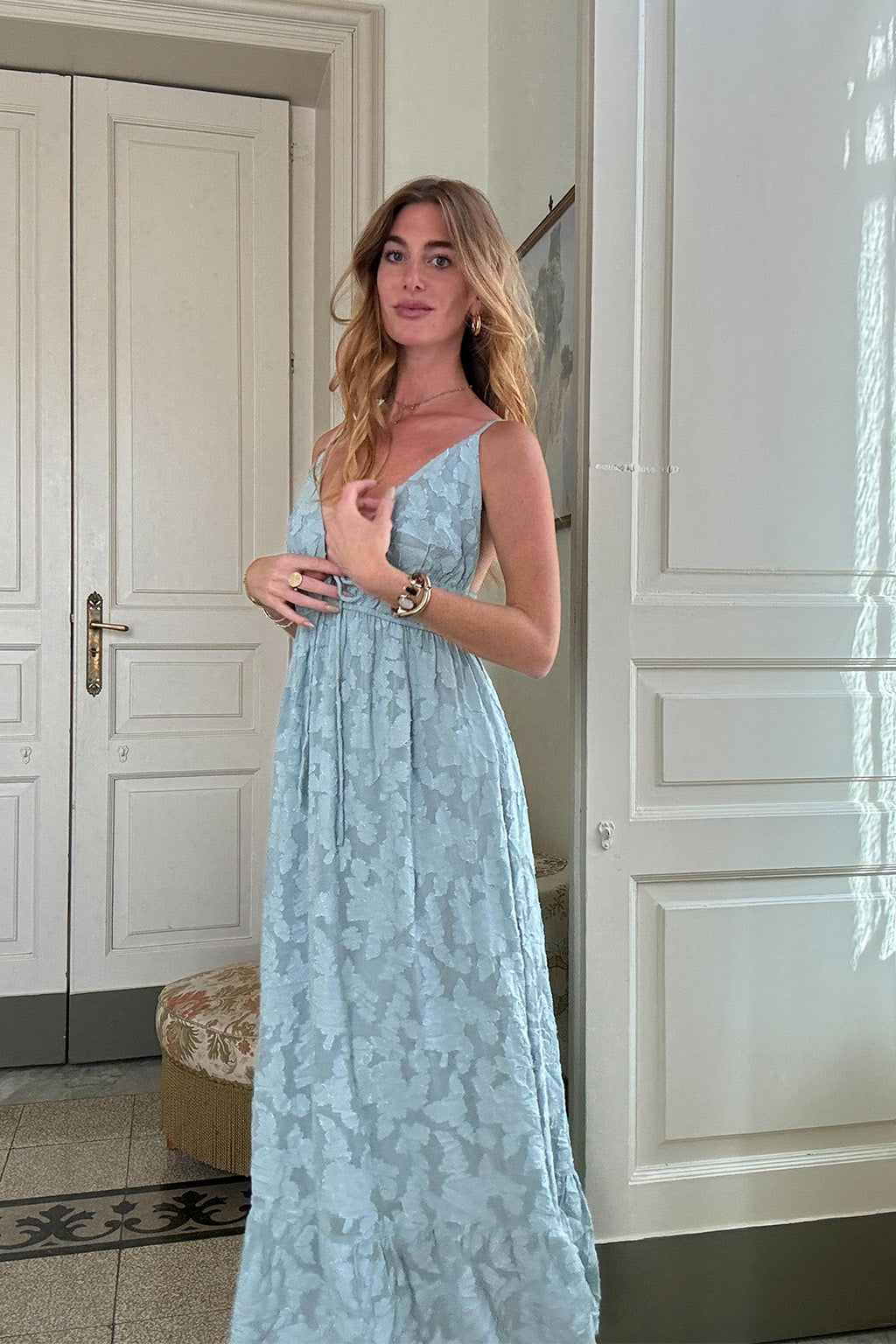 Back view of the blue maxi dress showing the silhouette and fit.