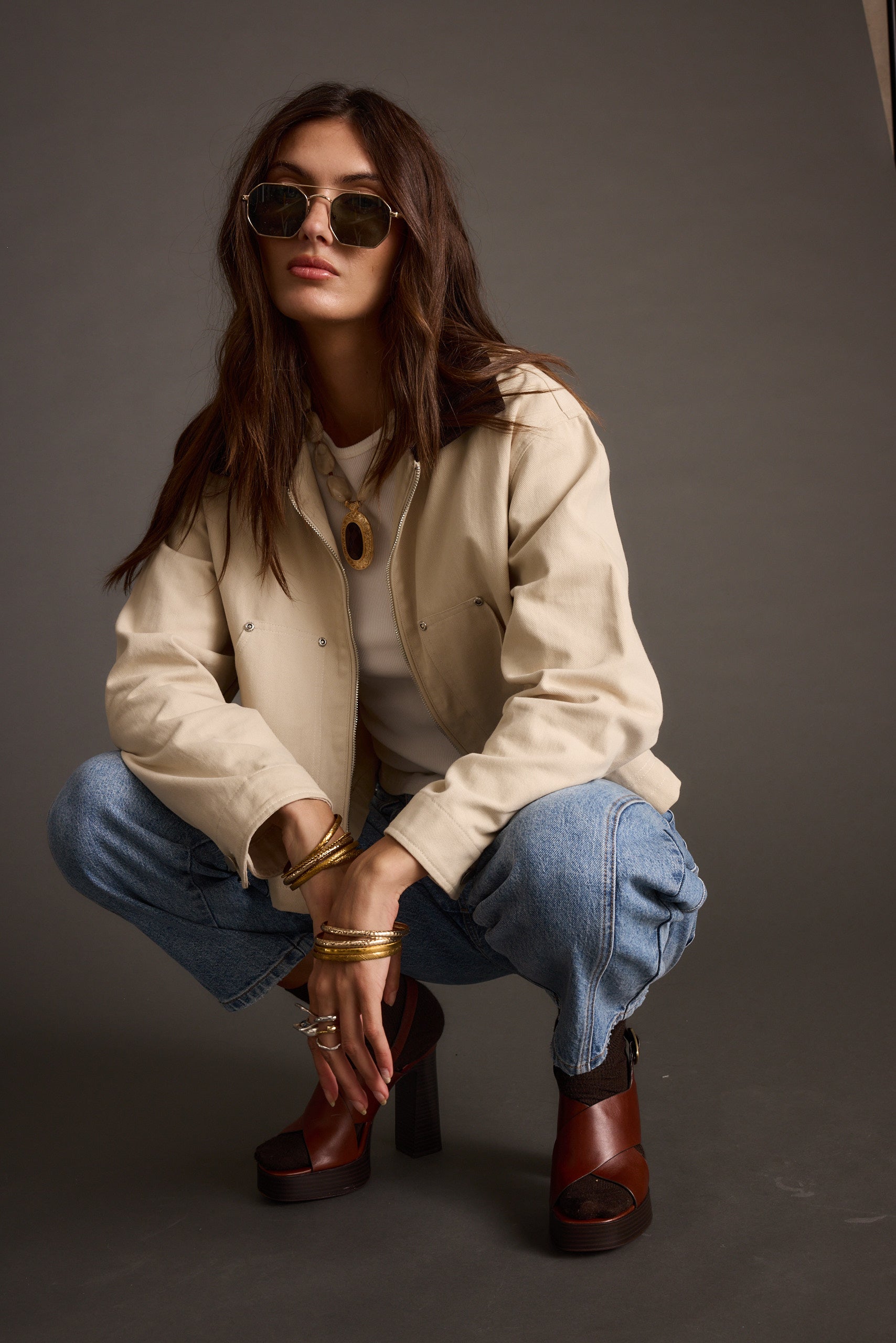 Lifestyle shot of the khaki barn jacket styled for day-to-night versatility.