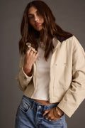 Khaki cropped barn jacket with refined detailing and a flattering silhouette.