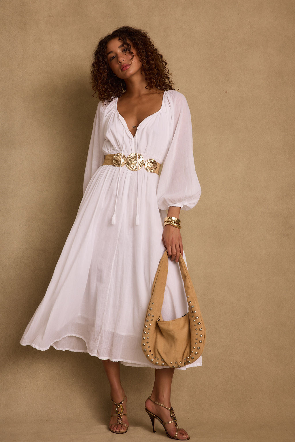 Danika White Linen Maxi Dress paired with complementary accessories for a polished look.