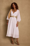 White linen maxi dress with refined accents, a white sequin dress essential.