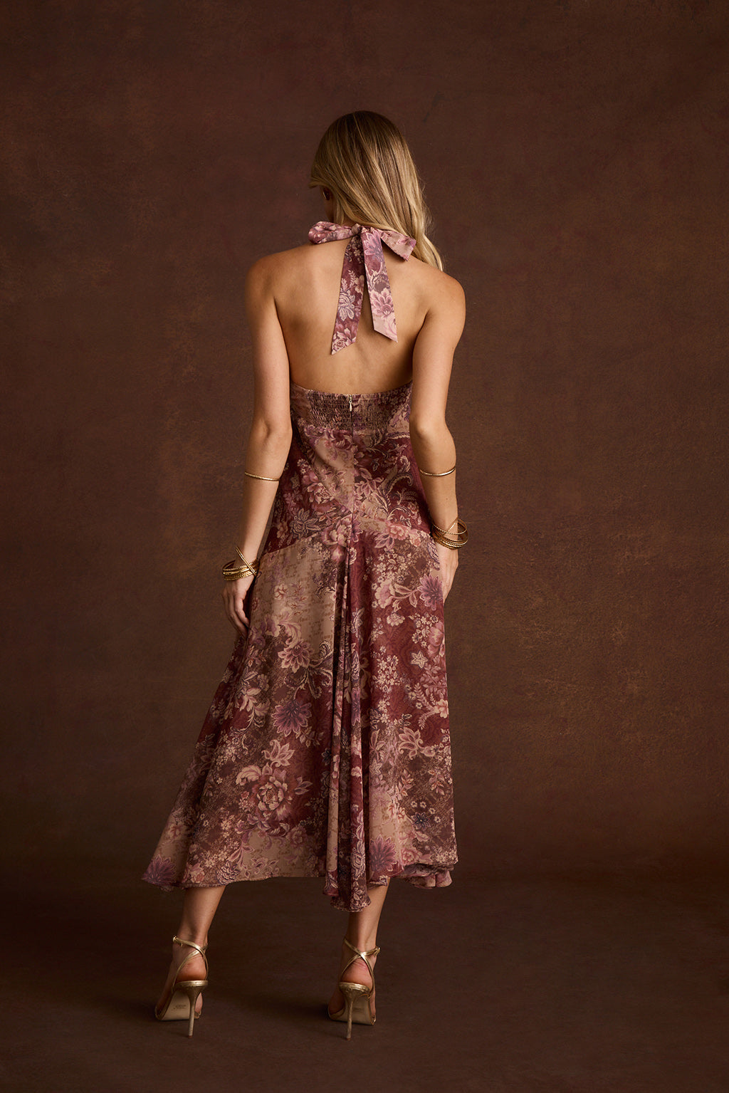Back view of Darcy berry floral chiffon halter maxi dress with tie neck.