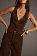 Brown corduroy vest with refined detailing and a flattering silhouette.