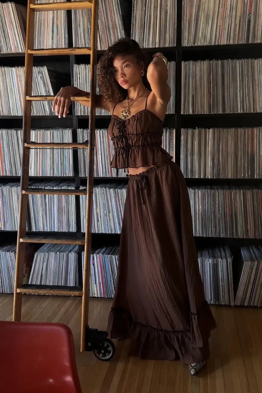 Brown maxi skirt with elegant accents, a lace maxi skirt essential.