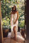 White satin maxi skirt with refined detailing and a flattering silhouette.