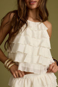 Ivory halter, ruffled halter top with refined detailing and a flattering silhouette.
