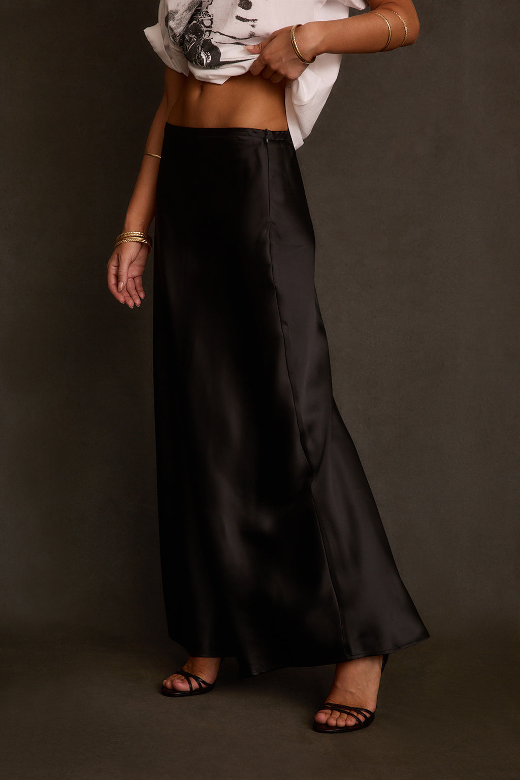 Maxi skirt back view with satin drape and relaxed bias cut from waist to hem