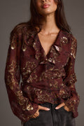 Plum blouse with refined detailing and a flattering silhouette.